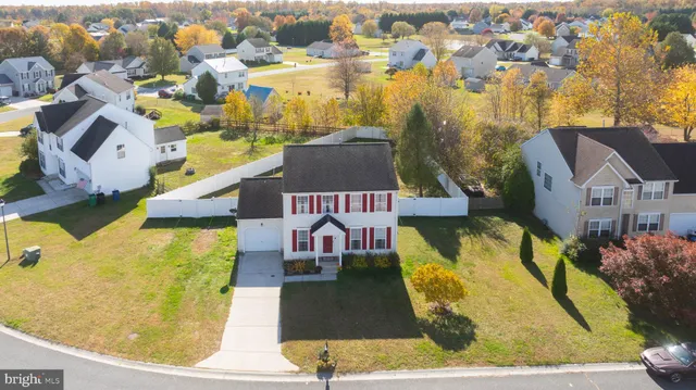 an aerial view of a house with a swimming pool