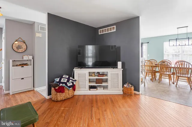 a view of a livingroom with furniture and wooden floor