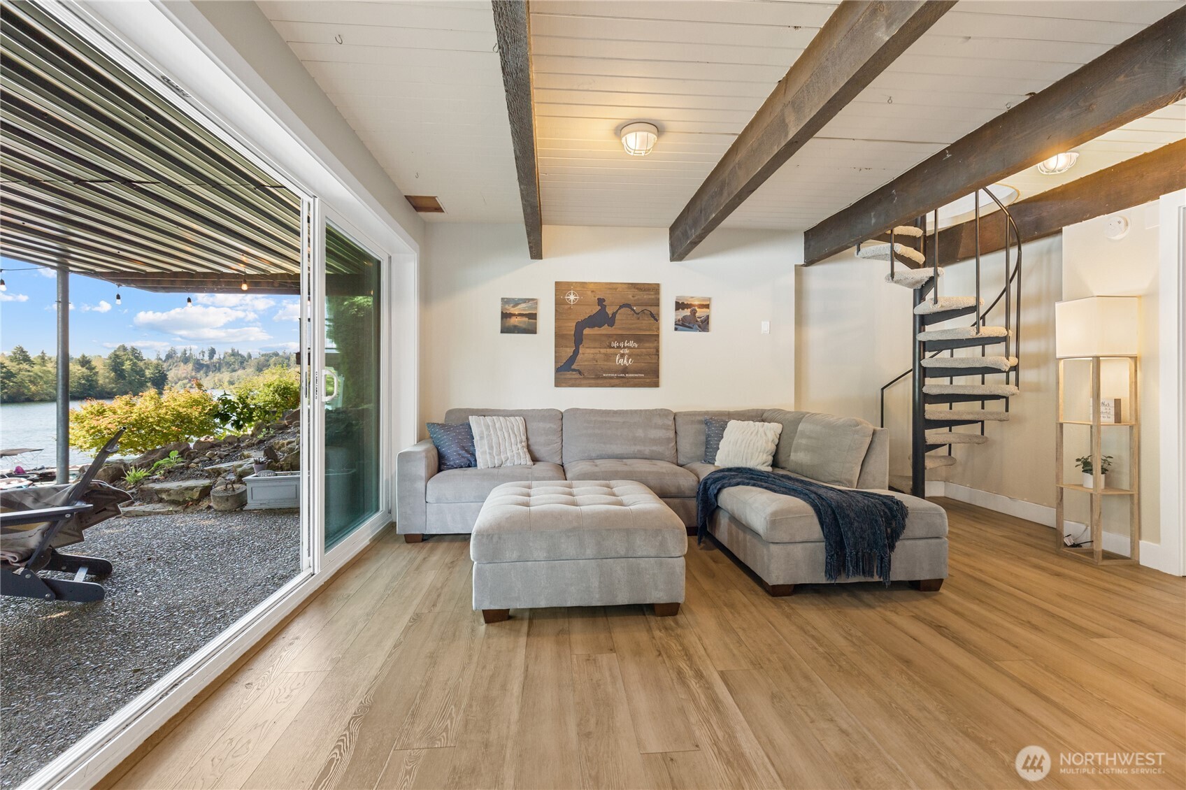 137 Lake Road Silver Creek, WA 98585 - Photo 14 of 32 a spacious bedroom with a bed couch and a large window