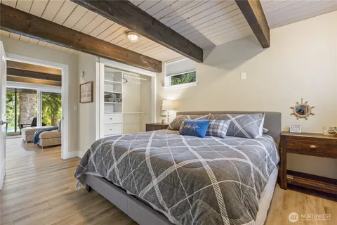 a bedroom with a large bed and a couch