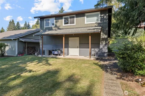 a view of a house with a yard and plants