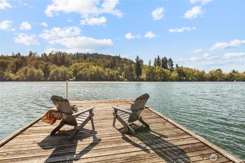 a view of a lake with outdoor seating
