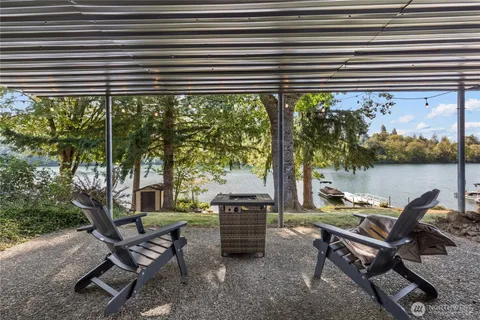 a wooden bench sitting in front of a building