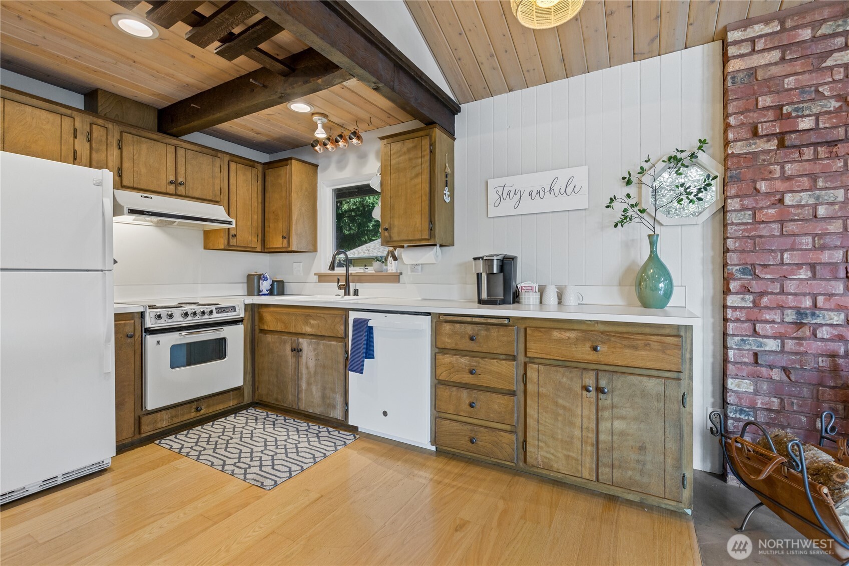 137 Lake Road Silver Creek, WA 98585 - Photo 6 of 32 a kitchen with a stove cabinets and wooden floor