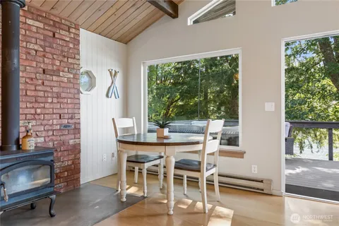 a dining room with furniture and windows