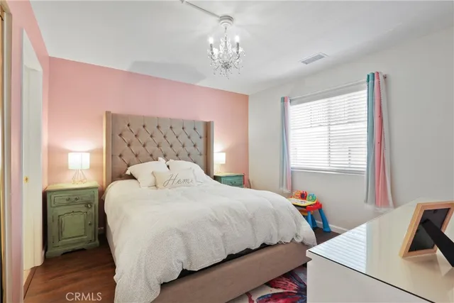 a bedroom with a bed and a table