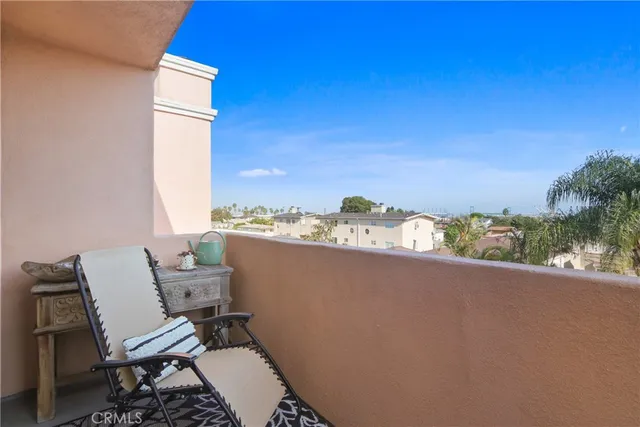 a view of a balcony with chair and table