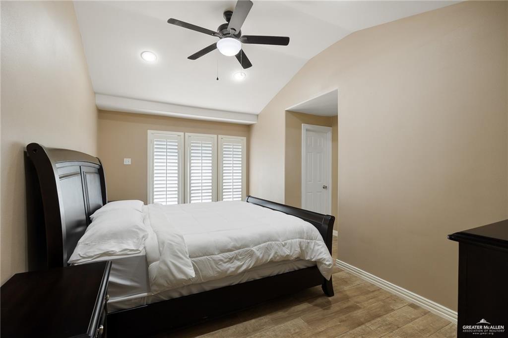 23474 North Val Verde Road Edcouch, TX 78538 - Photo 6 of 12 a bedroom with a bed a window and a chandelier