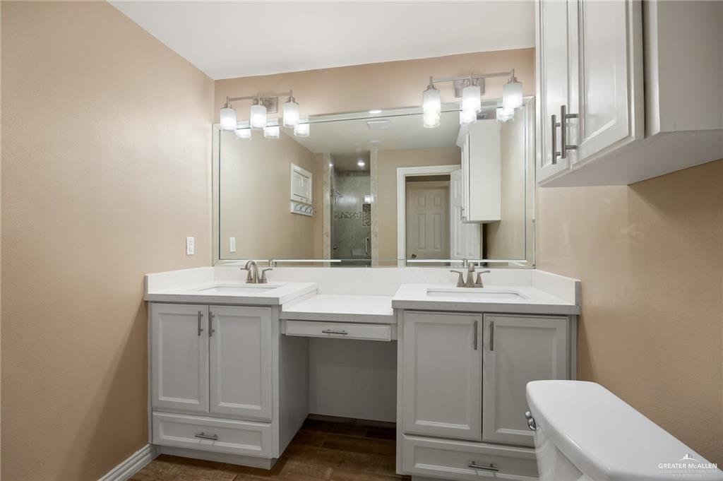 23474 North Val Verde Road Edcouch, TX 78538 - Photo 7 of 12 a bathroom with a toilet sink and mirror