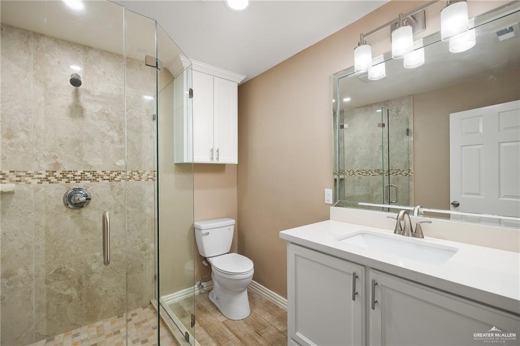 23474 North Val Verde Road Edcouch, TX 78538 - Photo 8 of 12 a bathroom with a sink a toilet and shower