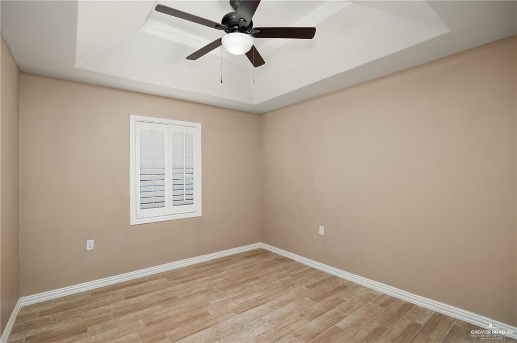 23474 North Val Verde Road Edcouch, TX 78538 - Photo 9 of 12 an empty room with a window and a fan
