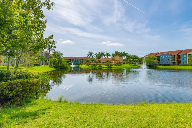 a view of a lake with houses in the back