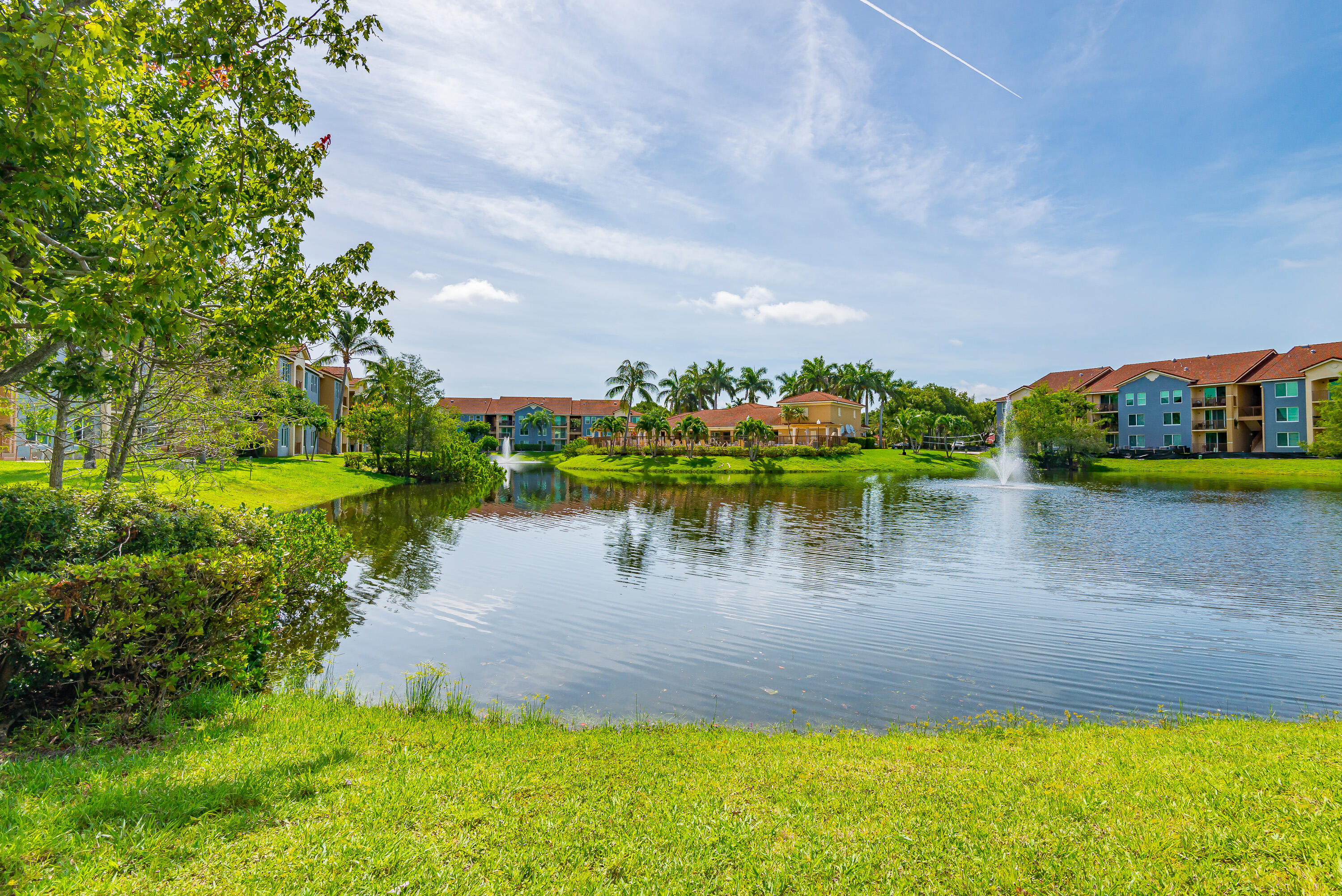a view of a lake with houses in the back