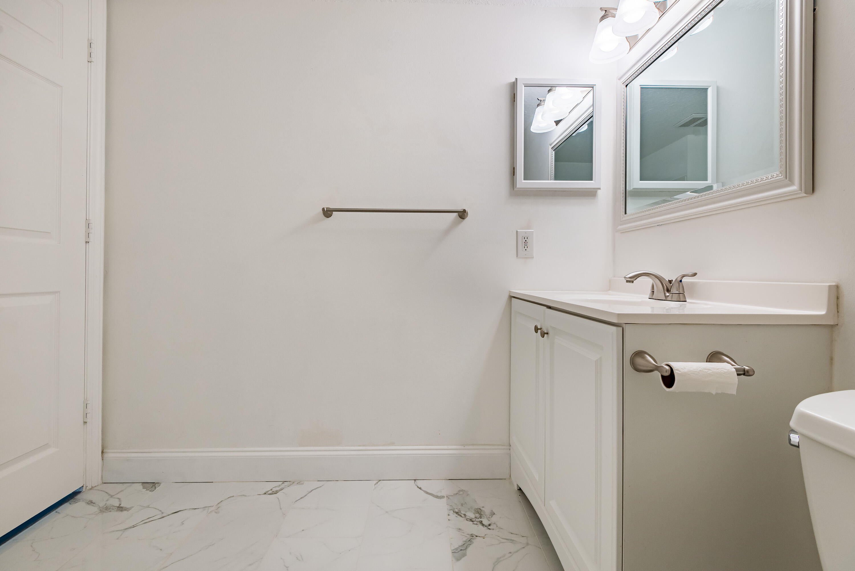 602 Villa Circle Boynton Beach, FL 33435 - Photo 14 of 27 a bathroom with a sink and mirror