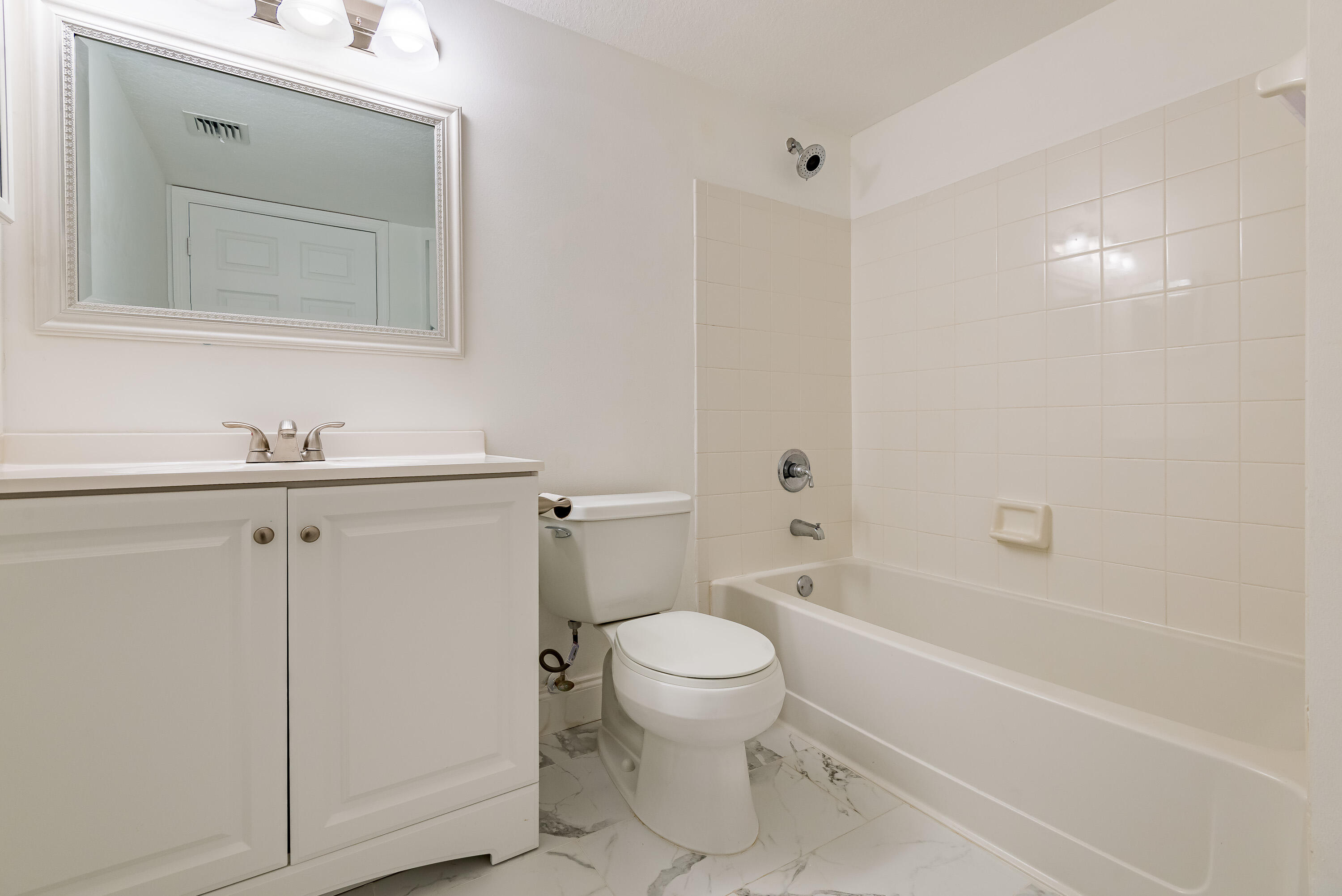 602 Villa Circle Boynton Beach, FL 33435 - Photo 18 of 27 a bathroom with a sink a toilet and shower