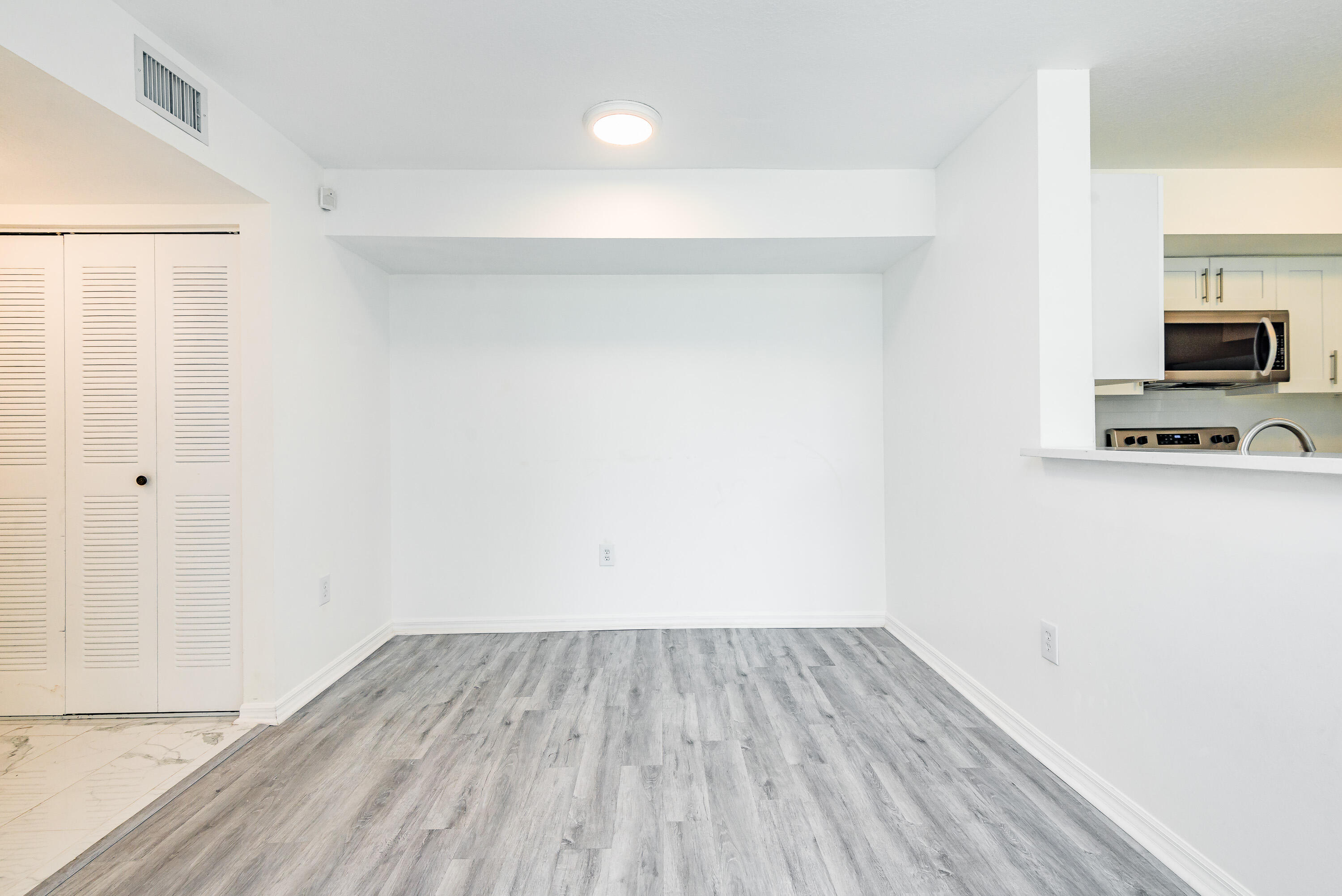 602 Villa Circle Boynton Beach, FL 33435 - Photo 8 of 27 a view of a room with wooden floor and a sink