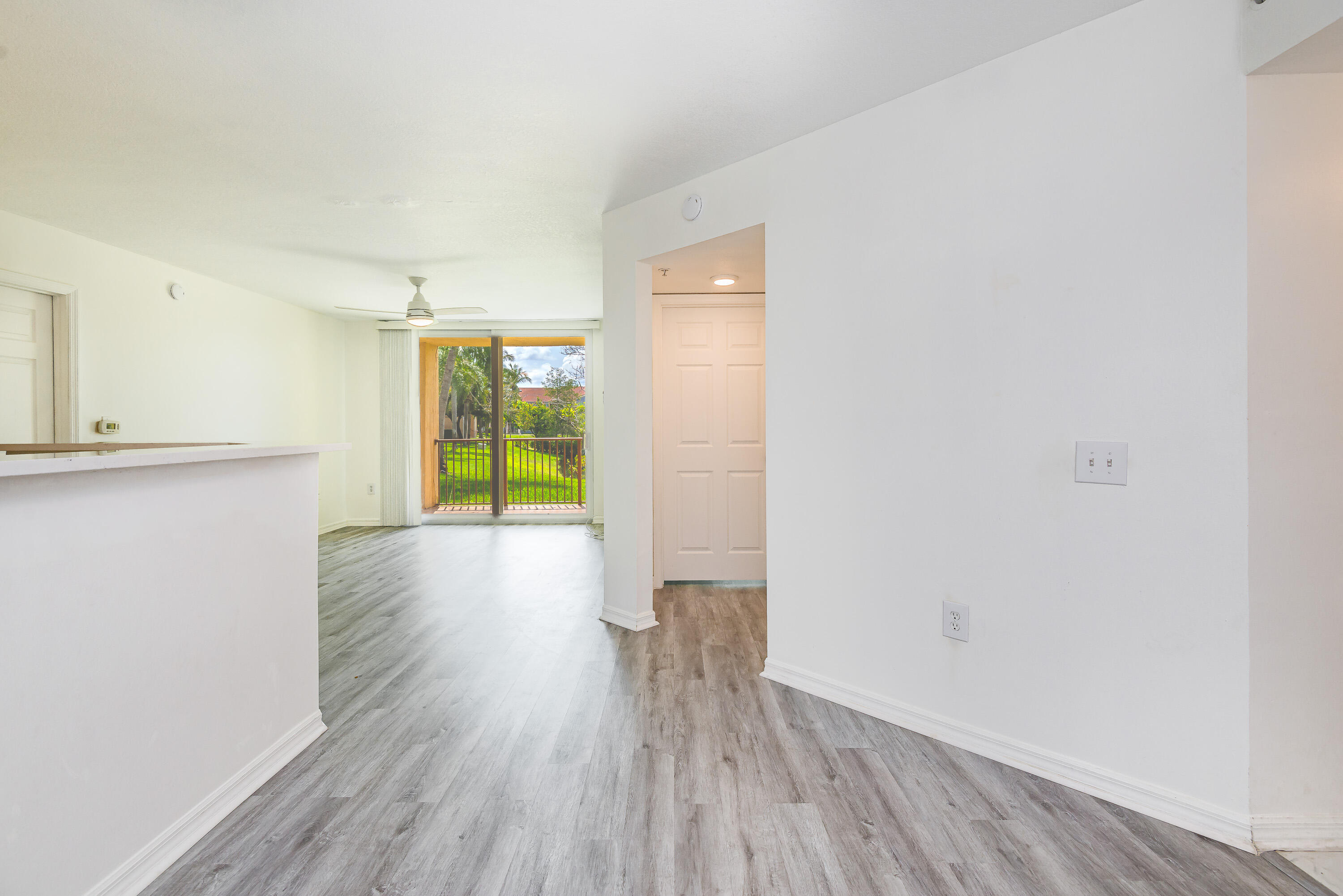602 Villa Circle Boynton Beach, FL 33435 - Photo 10 of 27 a view of a room with wooden floor and a window