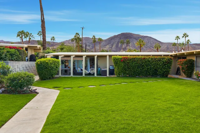 a view of a house with a garden