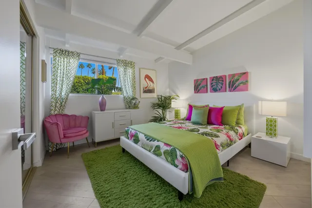 a bedroom with a bed and a couch