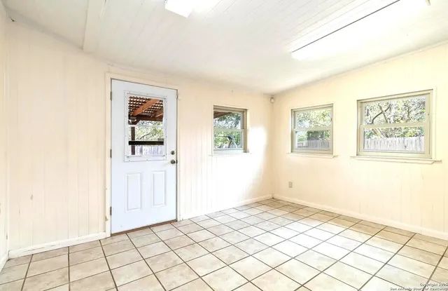 a view of an empty room and window
