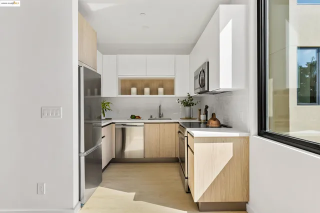 a kitchen with a stove top oven sink and cabinets
