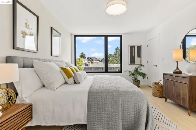 a bedroom with a bed and glass windows