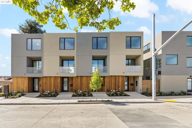 a view of a brick building next to a road