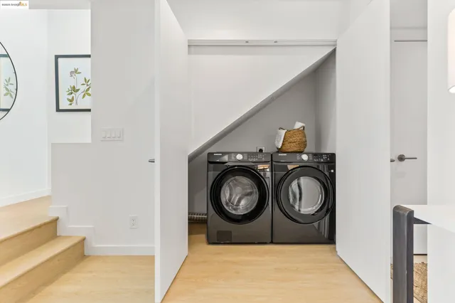 a bathroom with a sink and a washer dryer