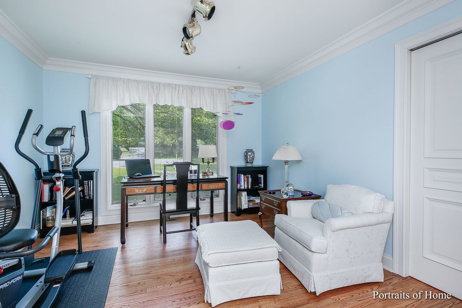 45 Cambridge Drive Oak Brook, IL 60523 - Photo 16 of 41 a living room with furniture a rug and a floor to ceiling window
