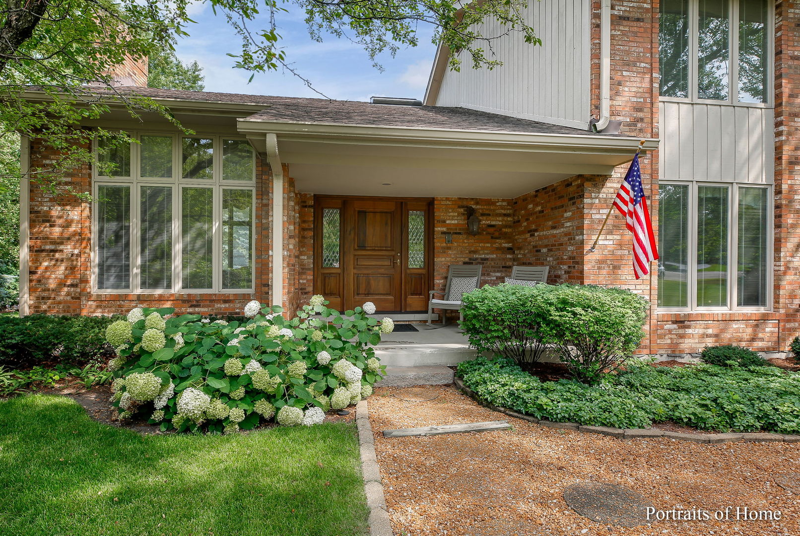 45 Cambridge Drive Oak Brook, IL 60523 - Photo 2 of 41 a front view of a house with garden
