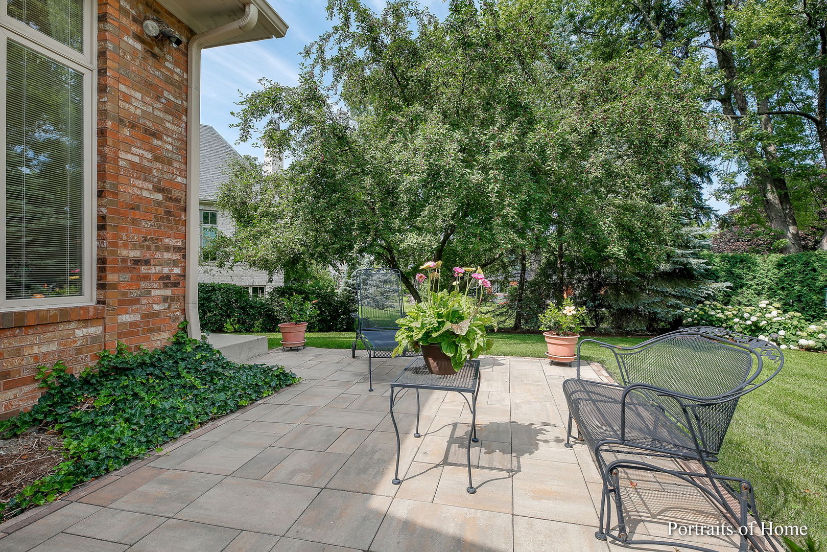 45 Cambridge Drive Oak Brook, IL 60523 - Photo 33 of 41 a view of a patio with furniture and a garden