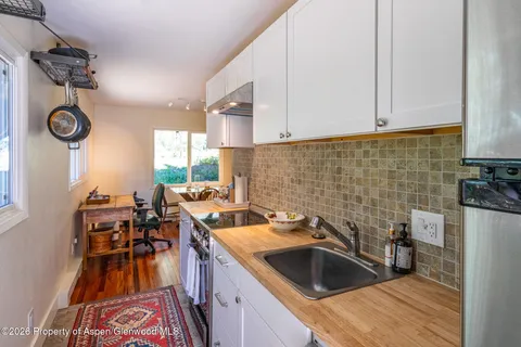 a kitchen with a sink and cabinets