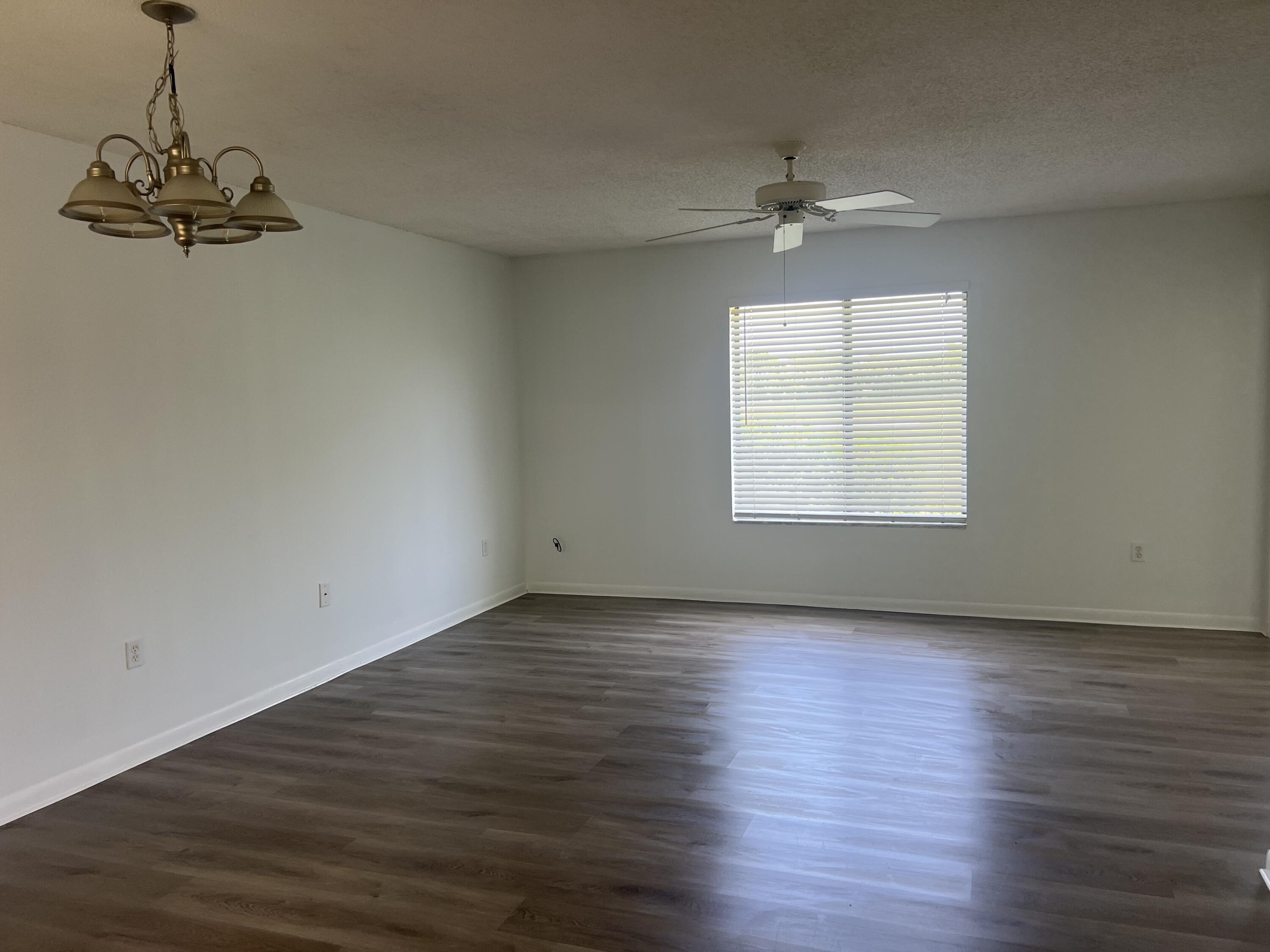 5373 Southeast Miles Grant Road, Unit 102 Stuart, FL 34997 - Photo 8 of 87 living and dining room