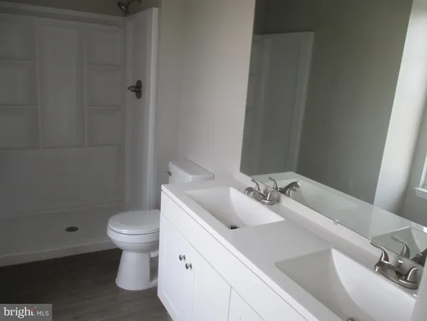 a bathroom with a sink toilet and bathtub