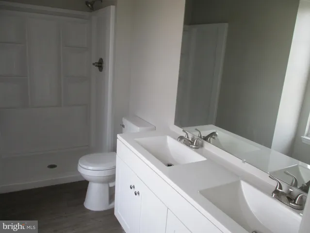 a bathroom with a sink toilet and bathtub