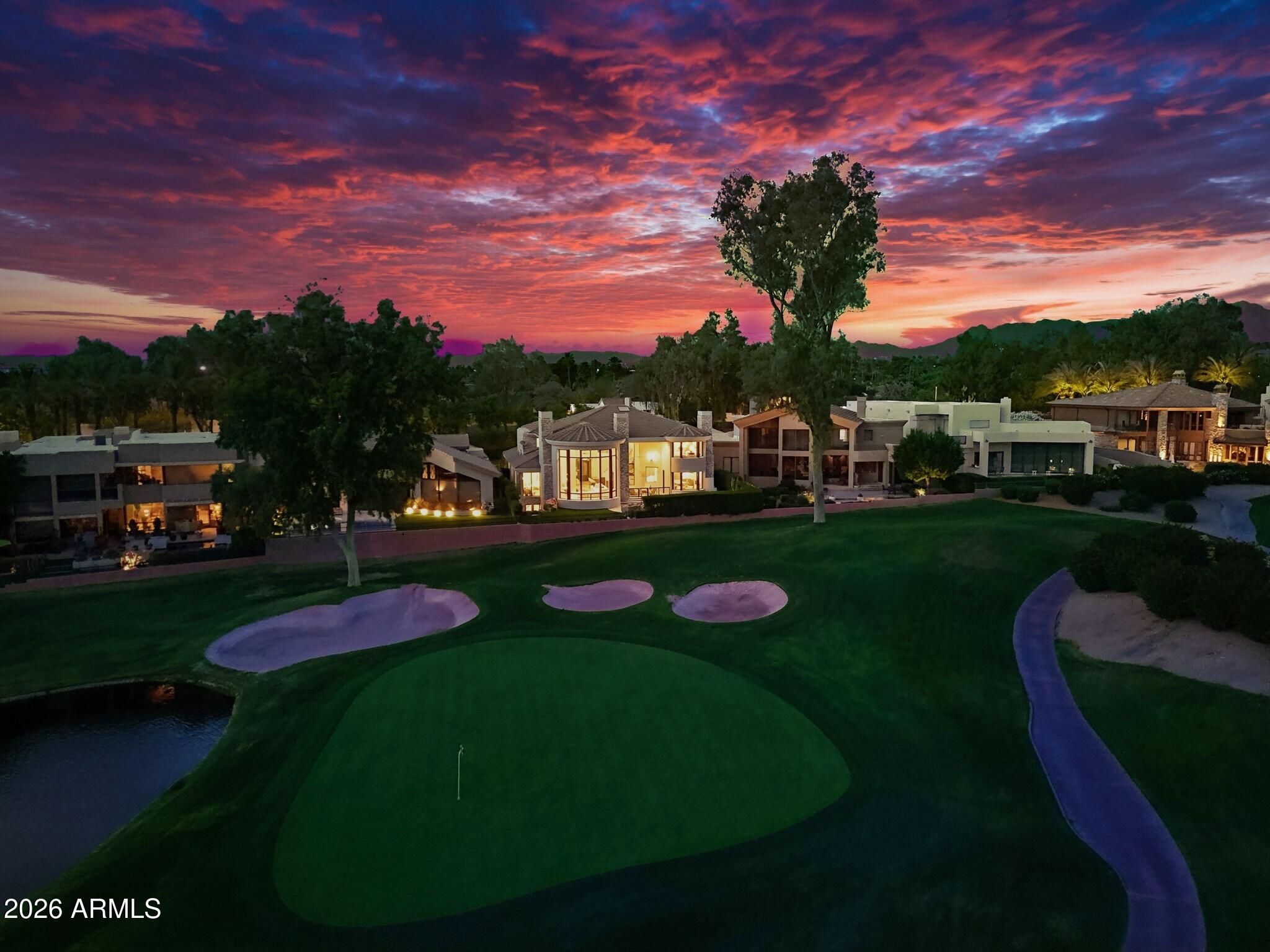 7475 East Gainey Ranch Road, Unit 7 Scottsdale, AZ 85258 - Photo 3 of 77 003_Twilight Aerial View