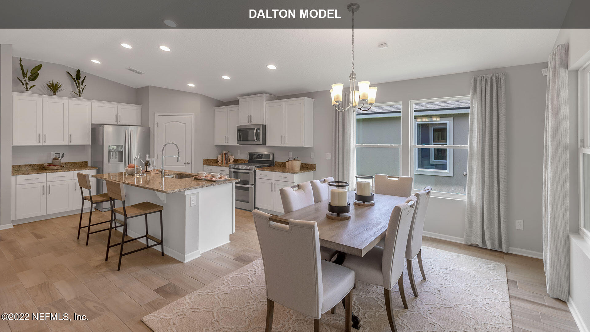 1360 Parkland Trail St. Augustine, FL 32095 - Photo 8 of 37 a dining room with kitchen island furniture a chandelier and kitchen view