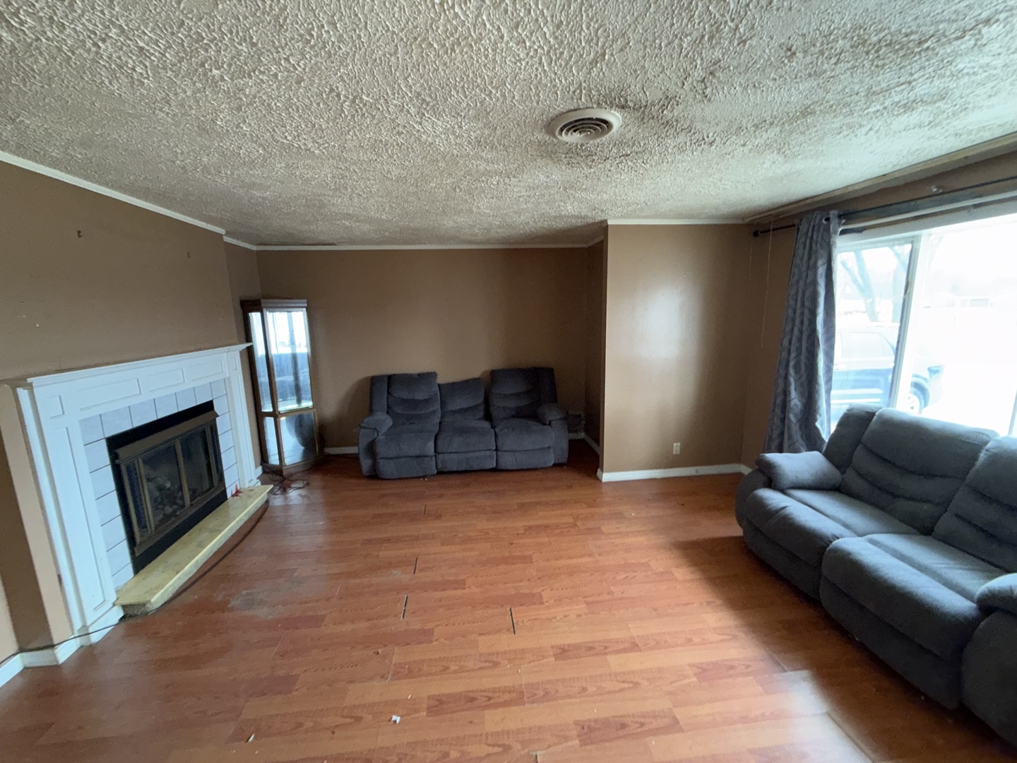 202 Wilson Street Park Forest, IL 60466 - Photo 3 of 9 a living room with furniture and a fireplace