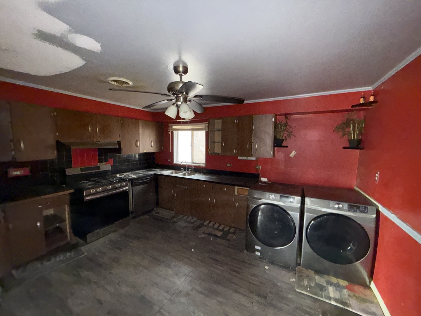 202 Wilson Street Park Forest, IL 60466 - Photo 4 of 9 a kitchen with stainless steel appliances granite countertop a stove and a wooden floors