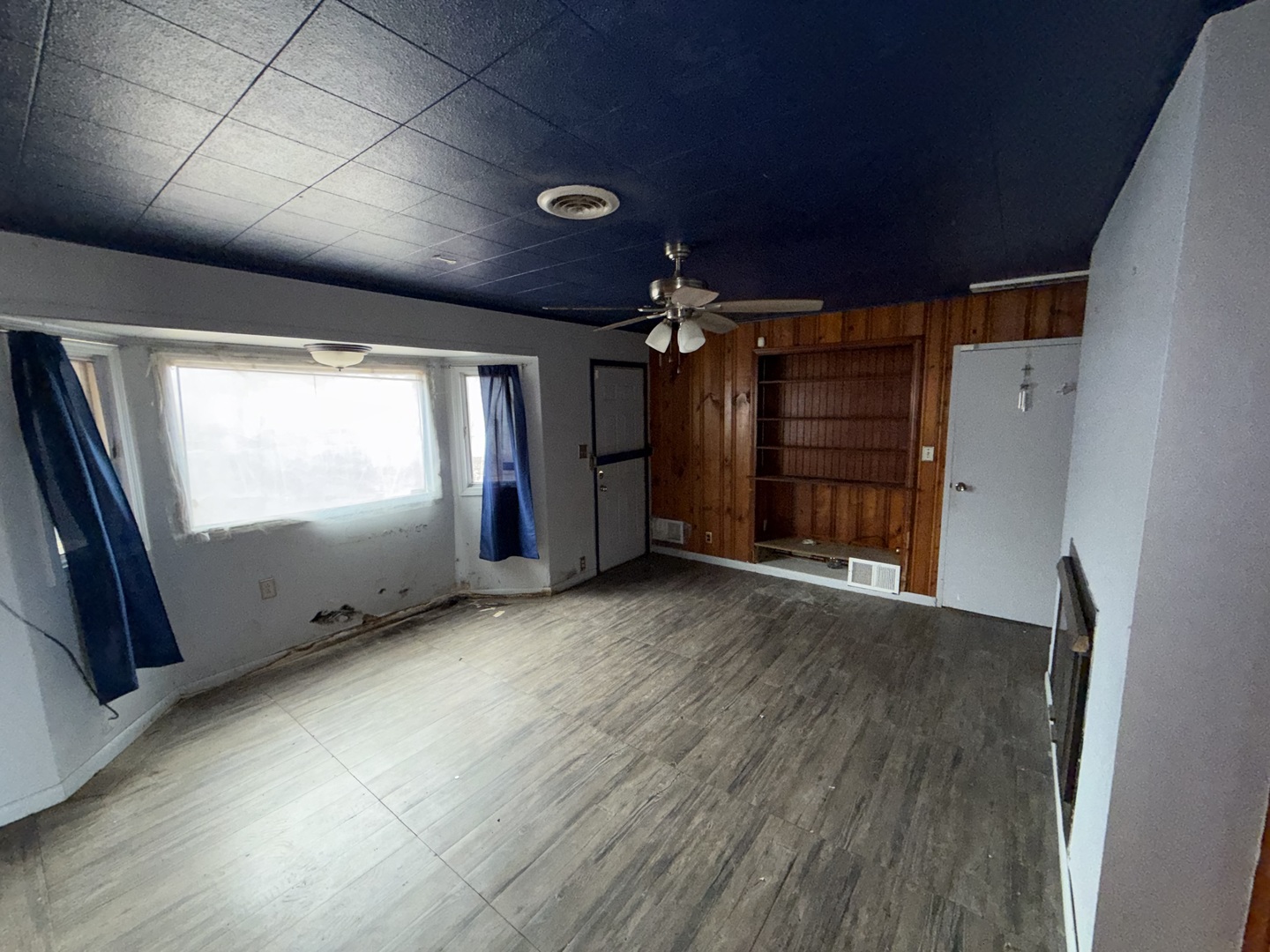 202 Wilson Street Park Forest, IL 60466 - Photo 8 of 9 a view of empty room with wooden floor and fan