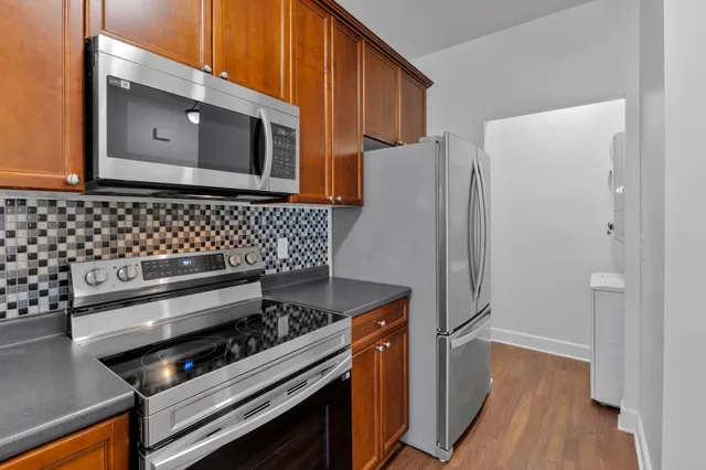 a bathroom with a toilet and shower