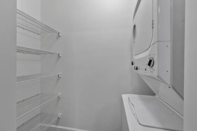 a view of a kitchen with a sink and a microwave