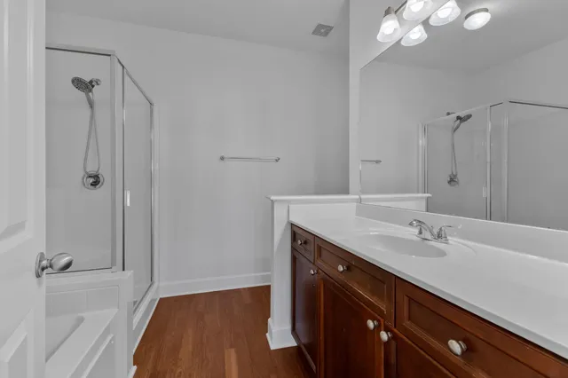 a bathroom with a bathtub and a shower