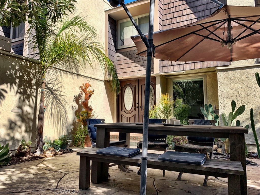 a view of a chairs and table in a patio