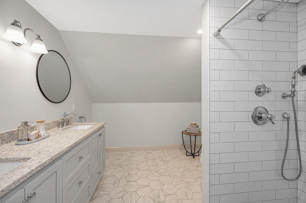 29 Washington Street Boxford, MA 01921 - Photo 27 of 39 a bathroom with a granite countertop sink a toilet and mirror