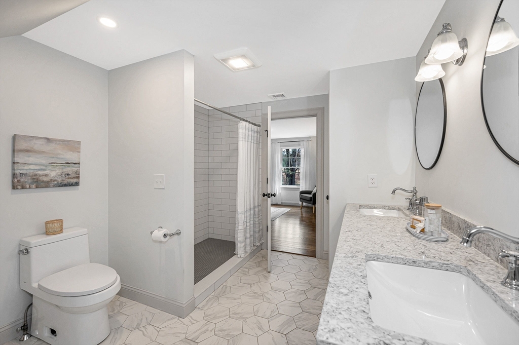 29 Washington Street Boxford, MA 01921 - Photo 28 of 39 a spacious bathroom with a granite countertop sink a toilet and shower