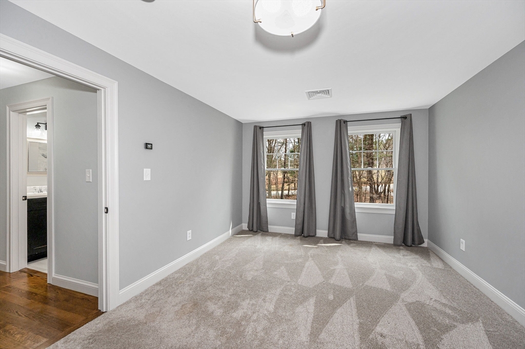 29 Washington Street Boxford, MA 01921 - Photo 29 of 39 an empty room with windows and closet