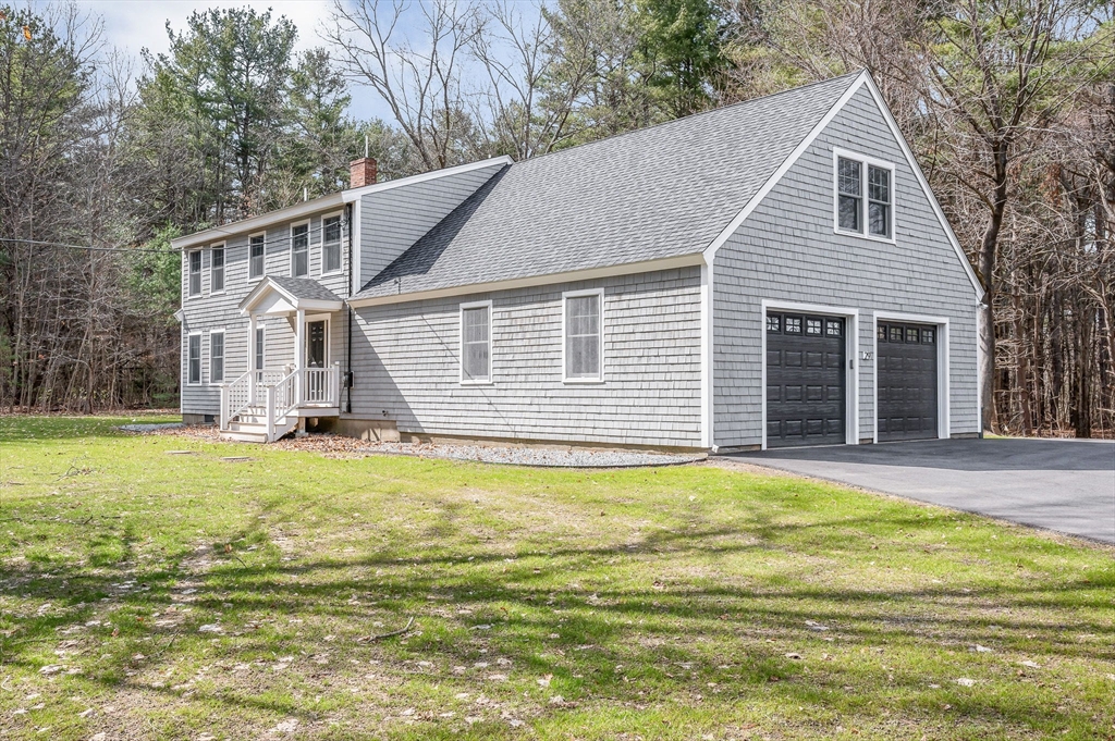 29 Washington Street Boxford, MA 01921 - Photo 36 of 39 a house that has a big yard plants and large trees with wooden fence