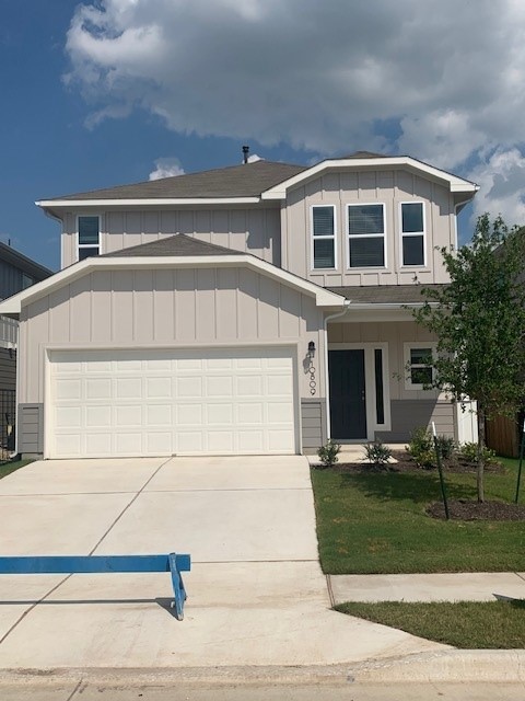 a front view of house with garage