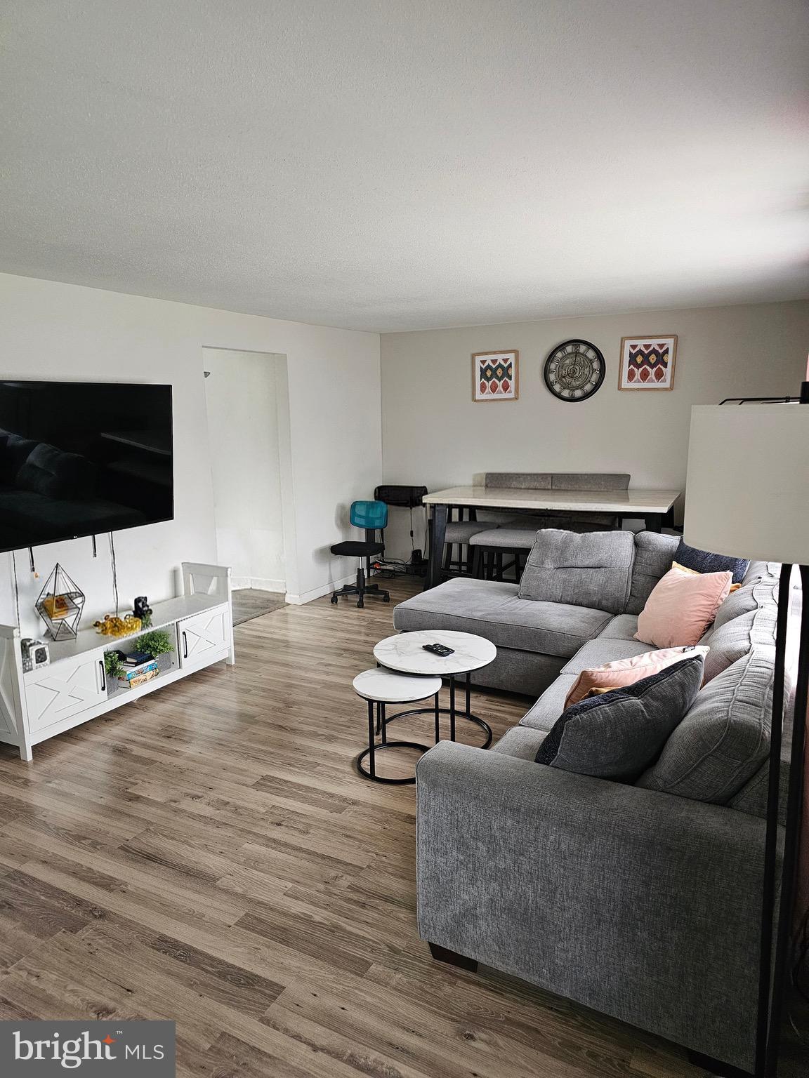 85 Hamilton Road Chambersburg, PA 17201 - Photo 2 of 13 a living room with furniture and a flat screen tv